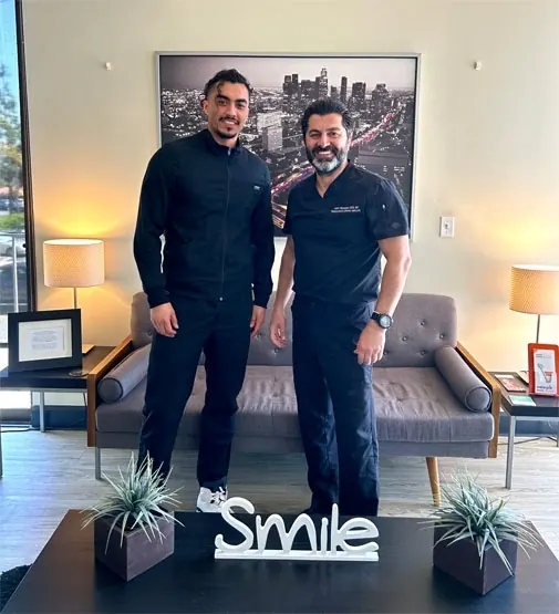 Two members of the Bixby Knolls Dental Group team in the practice's lobby.